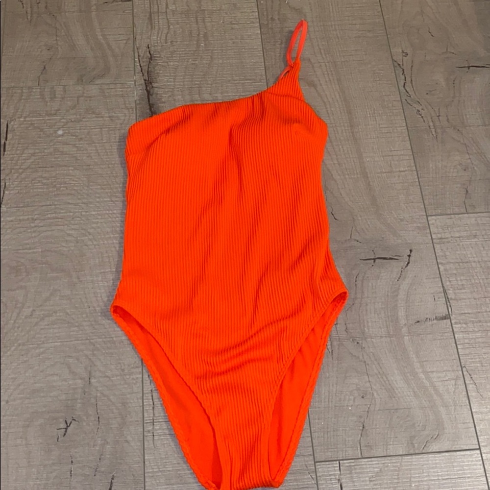Bright orange one shoulder, one-piece swimsuit